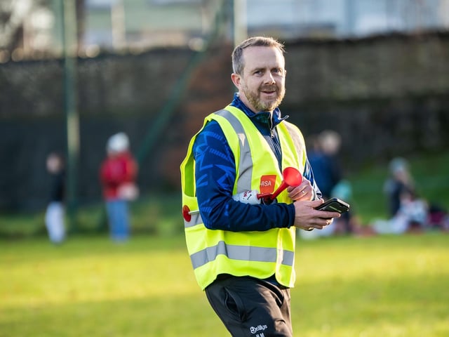 Brian Murray, one of the organisers of the North West Charity Cup, a cross border / cross community under 12s football tournament aimed at promoting girls football in the north west, watches the action at Duncreggan Road.