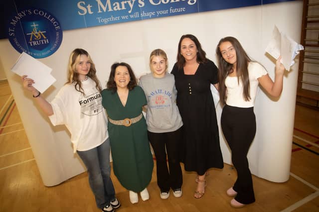 A-LEVELS!. . . St. Mary's College senior teachers Orla Mulhern and Yvonne Connolly congratulating A Level students Lisa Kennedy, Caitlin Morrison and Rachel Doherty on Thursday morning.