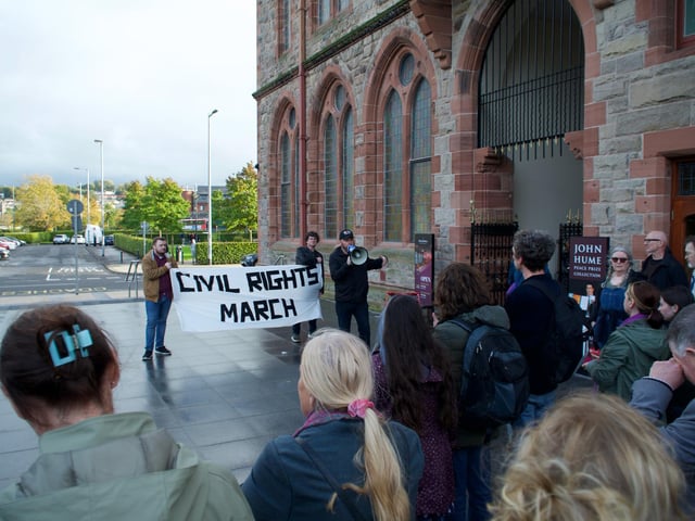 Davy McAuley speaks to the crowd at Guildhall.