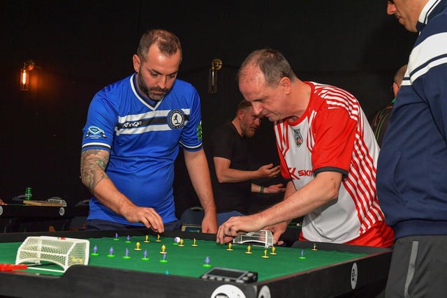 Dee Jenkins, Derry City Table Football Club, in action against an Italian opponent during the Subbuteo Irish Open held in the Nerve Centre. Photo: George Sweeney. DER2325GS - 117