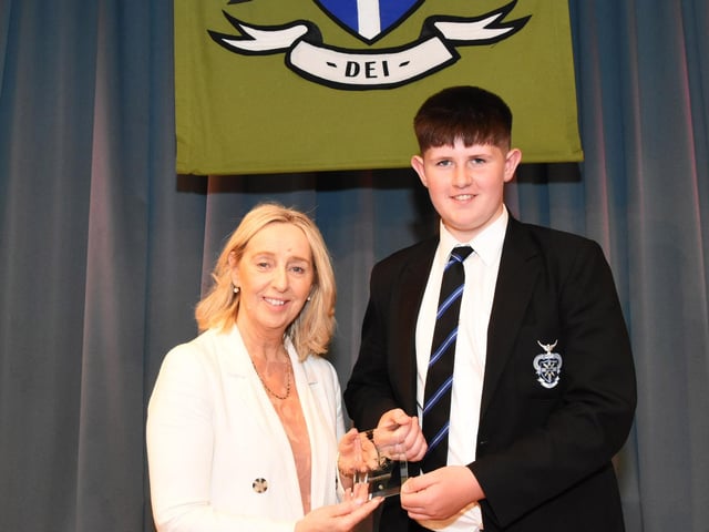Overall Year 9 Commitment prizewinner 2022-2023 Daibhin Boyd, 9F, receives his award from Mrs M Burns, Year Head and Senior Teacher.