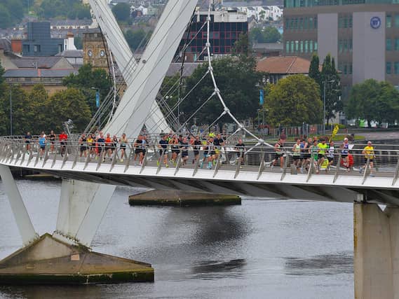 The 2024 Waterside Half Marathon competitors make their way across the Peace Bridge. Photo: George Sweeney