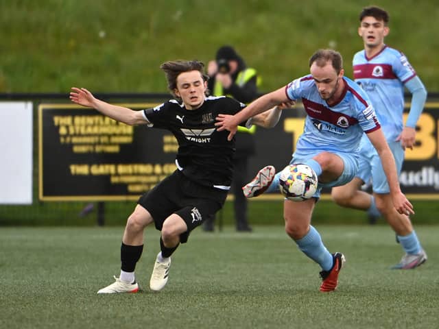 Institutes Conor Quigley  in action with Ballymena’s  Fraser TaylorMandatory Credit INPHO/Presseye/Stephen Hamilton