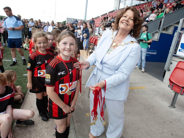 Mayor of Derry City & Strabane, Colr Patricia Logue, hands out medla at the Ryan McBride Brandywell Stadium.