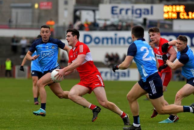 Dublin pair Cormac Costello and Eoin Murchan close in on Derry’s Padraig McGrogan during the Allianz Football League in Celtic Park. Photo: George Sweeney. DER2309GS – 44