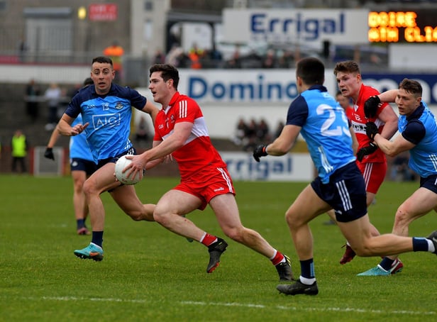 Dublin pair Cormac Costello and Eoin Murchan close in on Derry’s Padraig McGrogan during the Allianz Football League in Celtic Park. Photo: George Sweeney. DER2309GS – 44