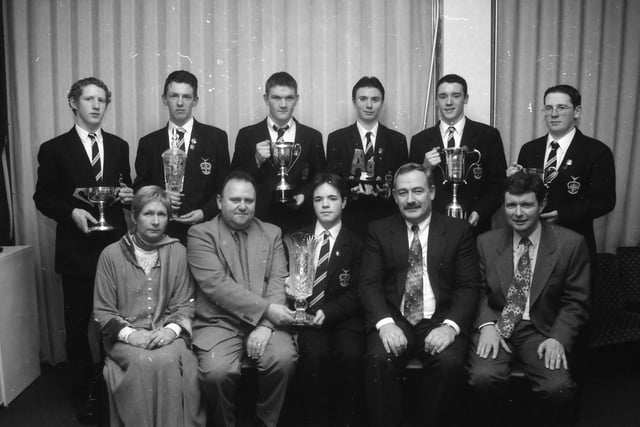 Mr. Chris Doherty, chairman, Parents' Association, seated, second from left, presenting the Parents' Association Award for GNVQ to Owen Bradley, at the St. Columb's College prize-giving. Included, at front, from left, are Mrs. Lorraine Houston, Year 14 Year Head, Mr. Frank McCauley, Head of Science, and Mr. Gerard Rainey, vice-president. Back, from left, are Gerard Gray (Psychology Prize), Eamon McDaid (Bank of Ireland Award for Physics), Peter Nelis (Biology Prize), Paul Kenny (Chemistry Prize), Kevin Glackin (Lawrence Duffy Award for Mathematics) and Niall Gillespie (Gormley Prize for Further Mathematics).