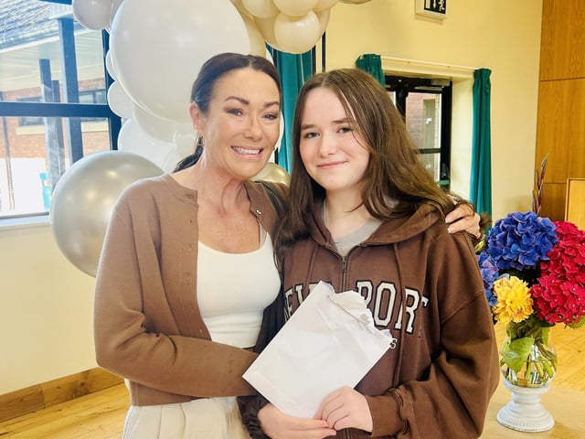 Ava Ryan pictured with her mum as she opens her GCSE results in Thornhill College.