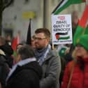 Protestors carry flags and placards during Saturday afternoon’s march and rally in Derry calling for a ceasefire in Gaza. Photo: George Sweeney