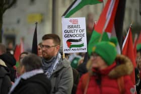 Protestors carry flags and placards during Saturday afternoon’s march and rally in Derry calling for a ceasefire in Gaza. Photo: George Sweeney