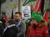 Protestors carry flags and placards during Saturday afternoon’s march and rally in Derry calling for a ceasefire in Gaza. Photo: George Sweeney