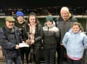 The Talbot Family receiving the Greyhound Data Trophy. From left; Barry Holland, Rian, Ceallach, Shane, Matthew and Grace Talbot.