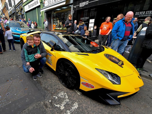 Caolan and his dad Aaron pictured beside one of the super cars that took part in the Bear Run from Derry’s Shipquay Street to Donegal and Inishowen, on Saturday morning, raising funds for Bumbleance, the Children’s Ambulance Service. Photo: George Sweeney. DER2317GS – 119