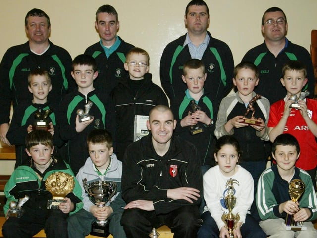 Top of the Hill Celtic under age award recipients pictured with Sean Hargan of Derry City when he was a guest at their presentation evening. Included in photo are club coaches Paul Miller, Keith Roddy (Chairman), Eamonn McLaughlin and Paddy Logue. (1402JB62)