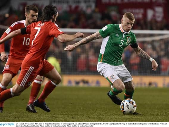 James McClean of Republic of Ireland in action against Joe Allen of Wales during the FIFA World Cup Qualifier Group D match between Republic of Ireland and Wales at the Aviva Stadium.