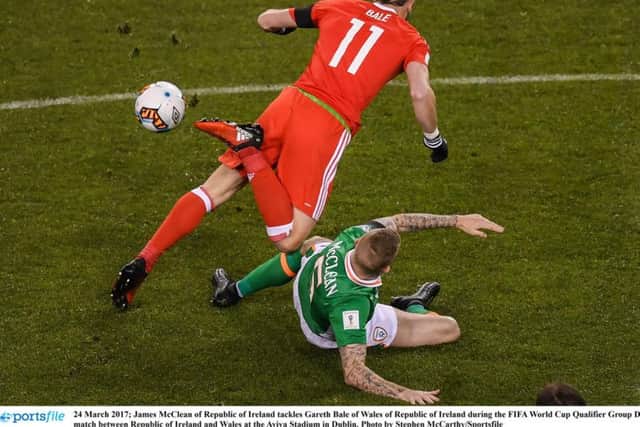 James McClean lets Gareth Bale know he's there with this crunching tackle after just four minutes of Friday's World Cup qualifier in Dublin.