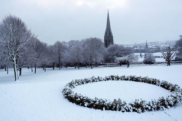Heavy snowfall in Brooke Park with St. Eugene's Cathedral in the background.