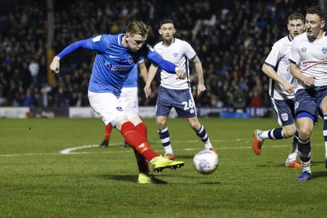 Ronan Curtis of Portsmouth scores his side's third goal to make the score 0-3 during the Checkatrade Trophy Semi Final match between Bury and Portsmouth at Gigg Lane.