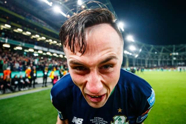 Ex-Derry City midfielder, Aaron McEneff celebrates winning the FAI Cup with Shamrock Rovers at the Aviva Stadium on Sunday.