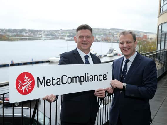 Robbie O'Brien, C.E.O. MetaCompliance and Invest NI Executive Director of Business and Sector Development, Jeremy Fitch.