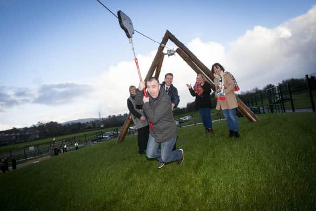 Local councillor Brian Tierney tries out the zip wire at the official launch of the new Play Area at Ballyarnett Country Park.