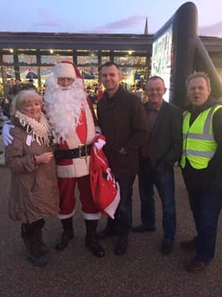 Maeve McLaughlin, Colr. Mickey Cooper, Colr. Eric McGinley and Billy Page with Santa at last year's event.
