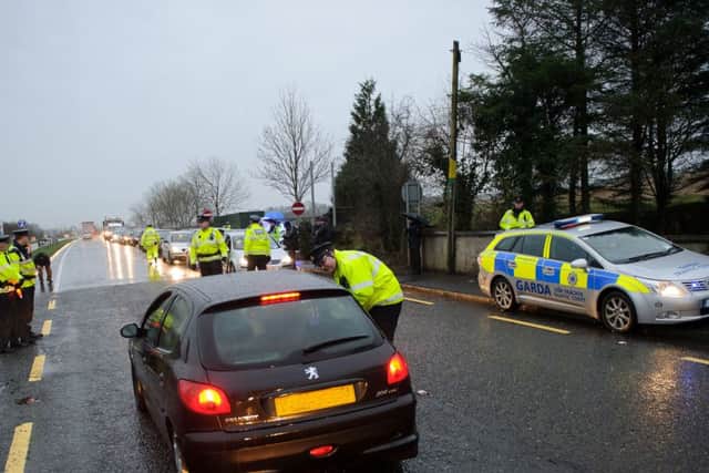 Garda and PSNI officer conducting a checkpoint in Bridgeend at the launch of the Cross Border Anti Drink Driving Campaign on Tuesday last. Photo- Clive Wasson