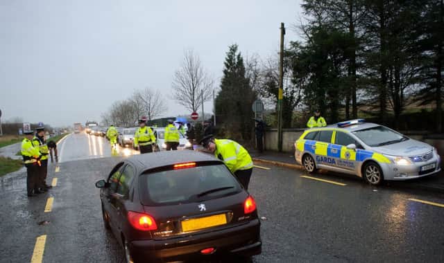 Garda and PSNI officer conducting a checkpoint in Bridgeend at the launch of the Cross Border Anti Drink Driving Campaign on Tuesday last. Photo- Clive Wasson