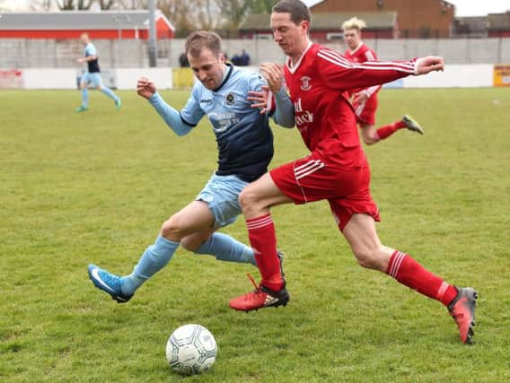 Ballyclare Comrades Adam Gray (red) scored a brace at Limavady United.