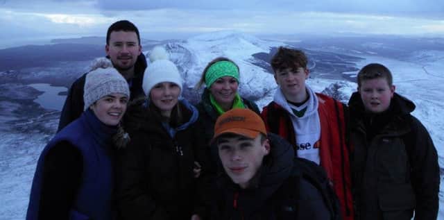 Young people from Enagh Youth Forum and Friends of Tiny Tots Community Play Group at the summit of Donegal's highest mountain.