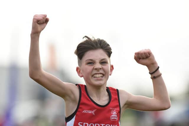 City of Derry's Oisin Duffy celebrates winning the Boys' Under-13 2500m at the AAI Novice & Juvenile Uneven Age XC Championships at the WIT Arena in Waterford. (Photo by Matt Browne/Sportsfile)