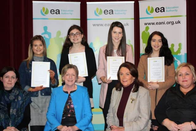 Young people who never missed a day off school in 12 or 14 yrs from 23 schools across Northern Ireland were celebrated at the Education Authorityâ¬"s third annual â¬ÜCelebration of Full Attendanceâ¬" event hosted by St Louiseâ¬"s Comprehensive College, Belfast. Pictured FR L-R Principal Mary McHenry, EA Director of CYPS Dr Clare Mangan, Chair of CYPS Cttee and EA Board Member Pat Carville and Nicola Topping EA CYPS. BR L-R Killain Frew and Chloe McCarron Limavady High School, Hannah Connell and Ashley Callaghan Limavady Grammar School.
