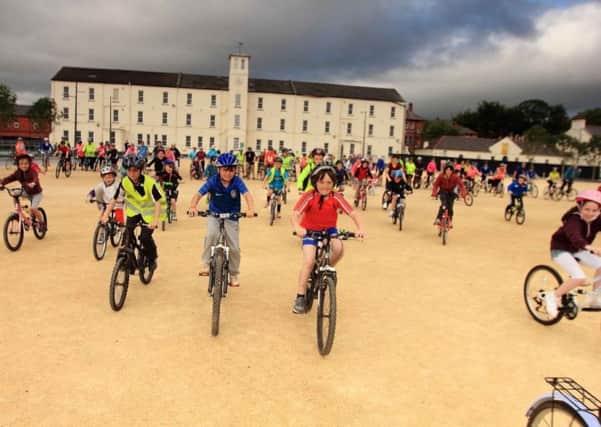 Cyclists take off from Ebrington Square.