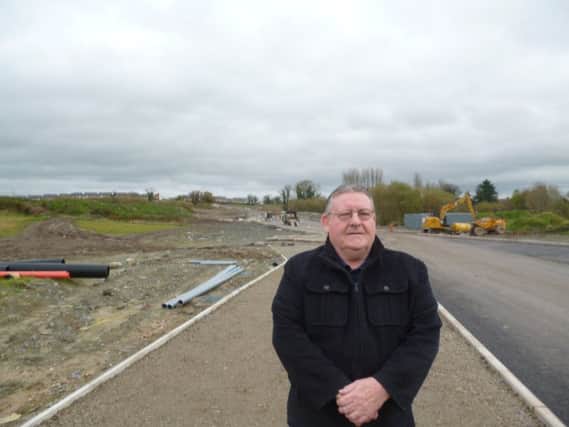 Sinn Fein Councillor Tony Hassan pictured at the development along Skeoge.