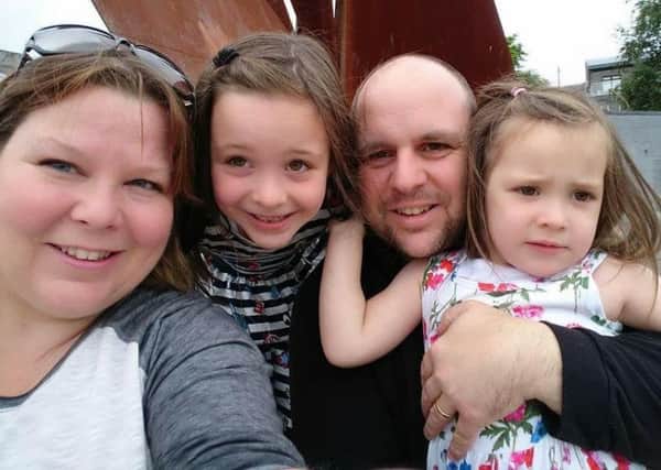 Ann Marie Coyle and her husband Christopher pictured with her children, Alice, left and, Molly, right.