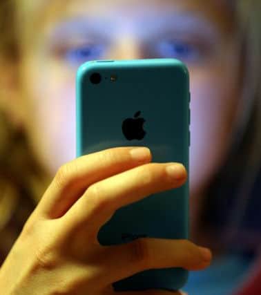 Predators can target young people through technology. Picture posed by model (Photo: Chris Radburn/PA Wire)