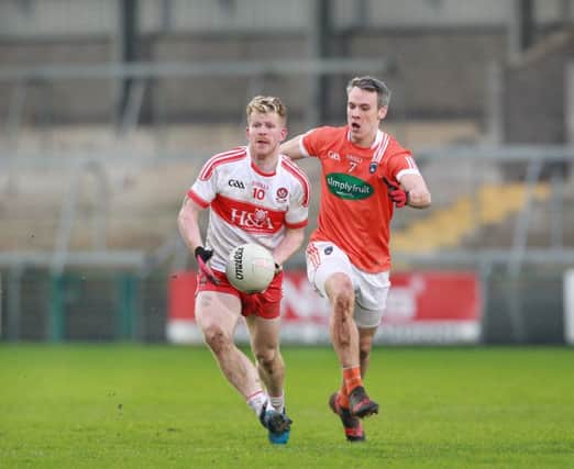 Enda Lynn takes on Armagh's Mark Shields  during Sunday's McKenna Cup match played at the Athletic Grounds, Armagh. (Picture Margaret McLaughlin)
