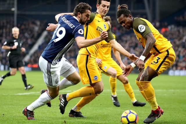 West Bromwich Albion's Jay Rodriguez (left), Brighton & Hove Albion's Lewis Dunk (centre) and Brighton & Hove Albion's Gaetan Bong (right) battle for the ball during the Premier League match at The Hawthorns.