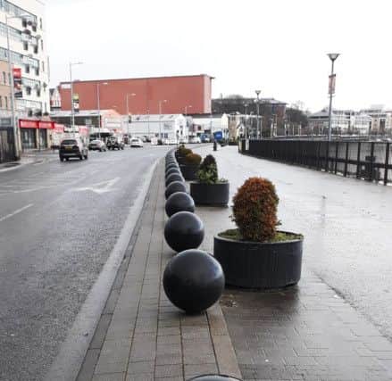 These spherical shaped bollards are located along Derrys riverfront.