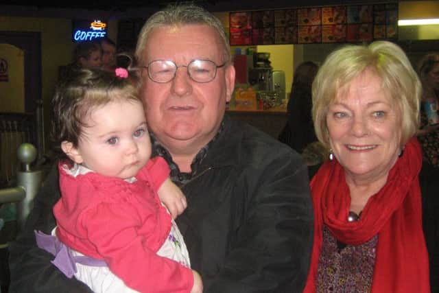 Tony Hassan pictured with his wife Christine and their granddaughter Tara.