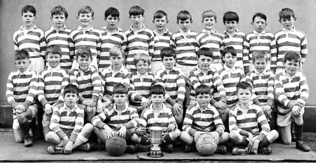 BOY WONDERS... Christian Brothers, Brow-of-the-Hill, Derry, winners of the Rice Cup in 1969. Centre in back row is John ONeill, who would go on to play for Northern Ireland in two World Cup finals, and centre of front row, holding the trophy, is John ONeill, chief songwriter with Derry punk icons, The Undertones.