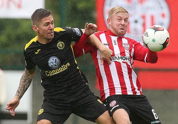 Scottish midfielder, Nicky Low, pictured playing for Derry City against Sligo's Daniel Kearns last season, has returned to Brandywell on a short term loan deal.