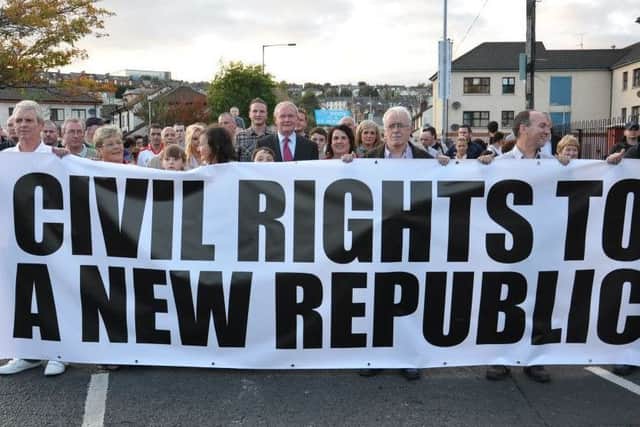 The late Martin McGuinness pictured several years ago at a rally in his native Bogside.