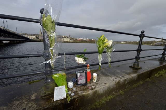Flowers and mementos for Michael McGinley left beside the River Foyle.  The 27-year-old, from the Gobnascale area, is missing since 21st January last.   DER0618GS029
