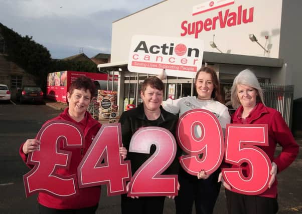 Action Cancers Amy Reynolds (second from right) is joined by SuperValu colleagues from Limavady (l to r) Roberta Mills, Ann Murray and Estelle Rose to celebrate raising Â£4295 for Action Cancer during Fundraising Week.