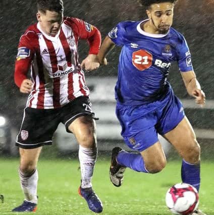 Derry City's Ben Doherty attempts to close down Waterford's dangerman, Bastien Hery.