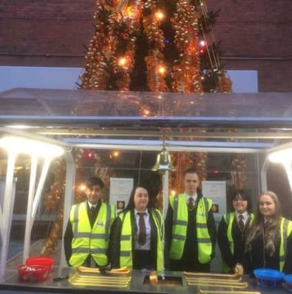 Young students volunteering at the Rotary Club Foyle Foodbank Drive outside Foyleside.