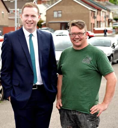 2016... NI Infrastructure Minister Chris Hazzard visits the residents' parking scheme area in the Bogside with Colm Barton, Triax Neighbourhood Management Team.