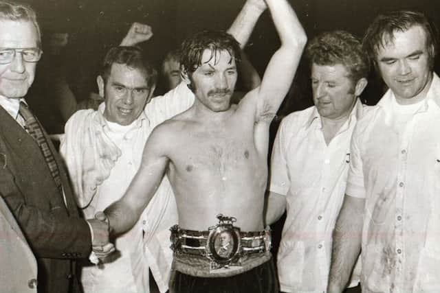 Charlie Nash has his hand raised after defeating Johnny Clayton to win the British title at the Templemore Sports Complex in 1978.