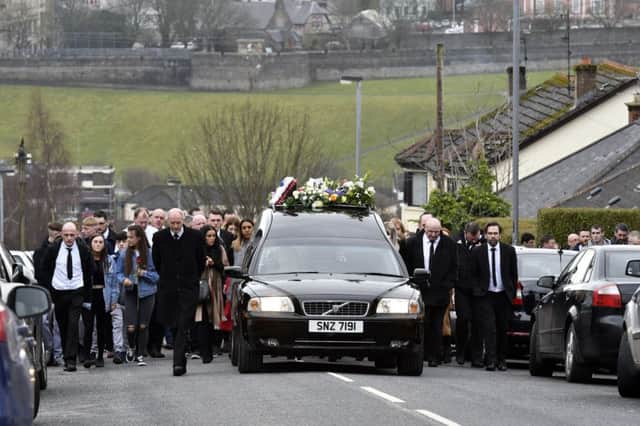 The funeral of Karol Kelly leaves his home on Beechwood Avenue on its way to St. Mary's Church, Creggan, on Sunday afternoon. DER1118-126KM